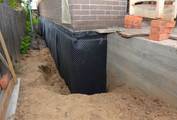 Happy homeowners after waterproofing job in Johnson City